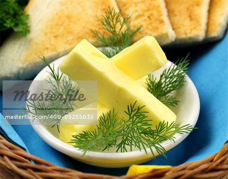 Tray of butter sticks with Italian parsley ready to serve.