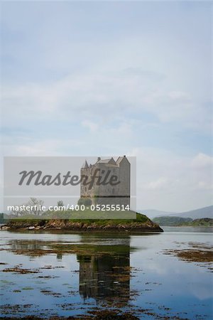 small medieval castle stalker on small island in loch linnhe argyll in the scottish highlands