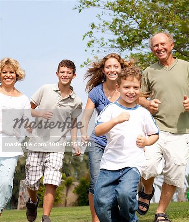 family chasing kid in a playful mood