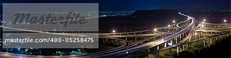 Panoramic cityscape of freeway in night with cars light in modern city in Taiwan, Asia.