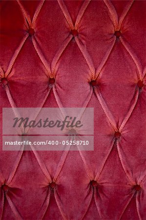 Luxury red fabric texture on an old sofa