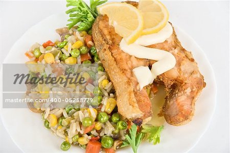 Close up Red fish, rice and vegetable dish isolated on white