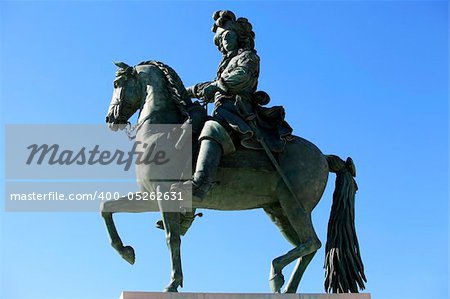 Louis XIV's statue in front of the Versailles Chateau