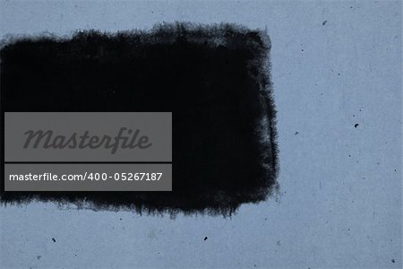 black square inkblot in a blue old paper background