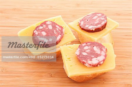 Sandwiches with sausage, cheese and bread