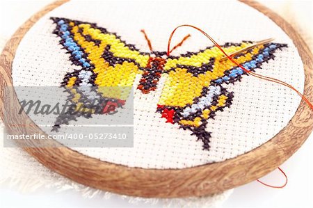 Butterfly embroidered on embroidery hoop