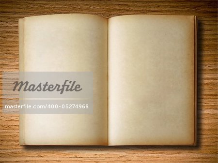 old book open on oak wood background