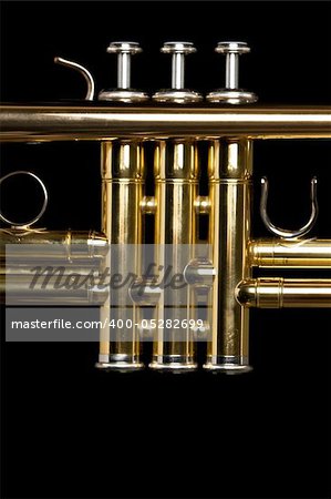 Valves of a trumpet on black background