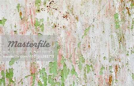 Background - a wall of the destroyed building with the damaged paint