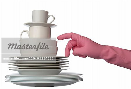 close up of stack of white ceramic dishes ready for fashing and hand in glove on white background with clipping path
