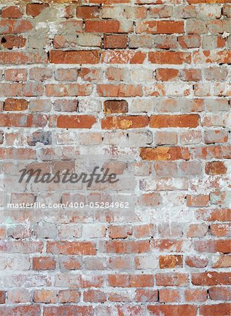 Vertical background - dilapidated red brick wall with patches of mold
