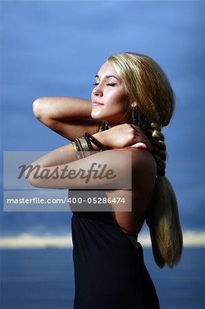 sexy and luxury woman on sunset backgroung