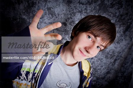 Hip-hop dancer posing on a dark background