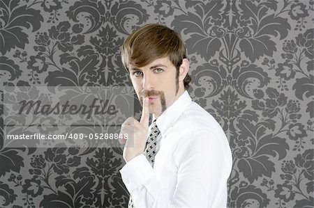 silence finger gesture retro businessman on vintage wallpaper