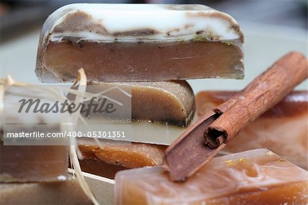 Macro handmade soap and cinnamon sticks spa composition