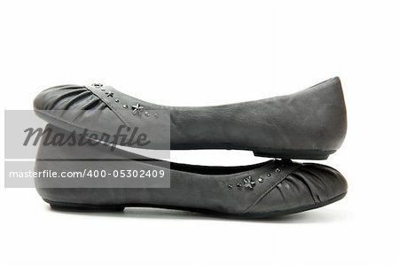 pair of grey teen girl's shoes isolated on white