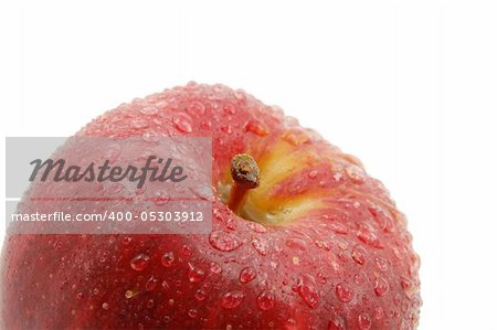 fresh red apple with water drops isolated on white background