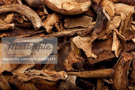 some dried cep mushrooms forming a background pattern
