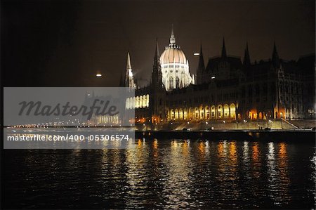 budapest hungary capital building and chain bridge at night from danube river