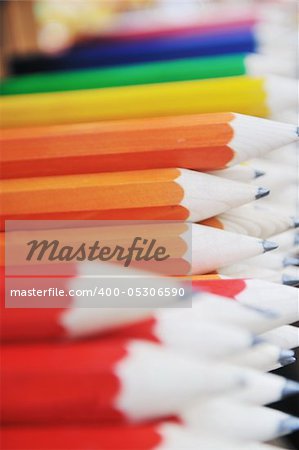 big wooden colored pencil arranged outdoor for sale like souvenir