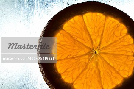 Cut orange on wet surface