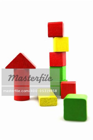 Wooden building blocks on white background. Close Up.