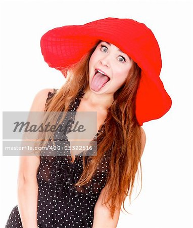 Woman in red hat posing against white background and showing her tongue.