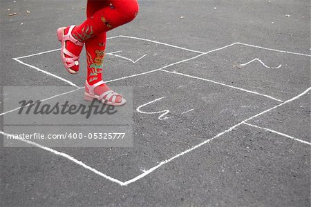 An image of playing girl on the asphalt