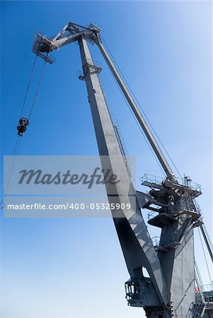 big harbor crane in the background of blue sky