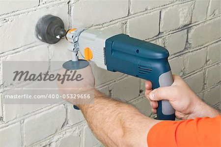 Builder hold perforator and drilling brick wall