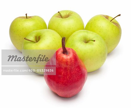 A ripe red pear and green apples as triangle