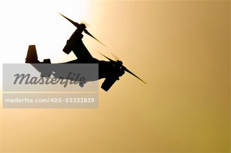 A Marine Corps V-22 Osprey makes an early morning flight