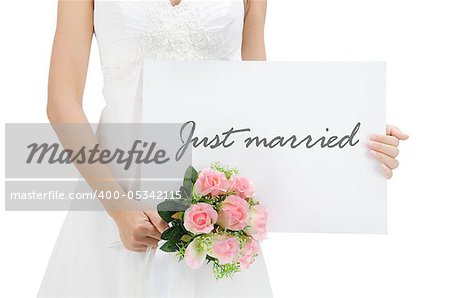 Bride holding a just married card