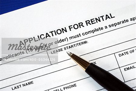 Signed the rental application with a pen