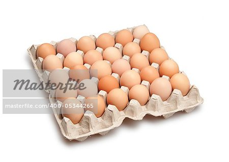 many brown eggs isolated on white