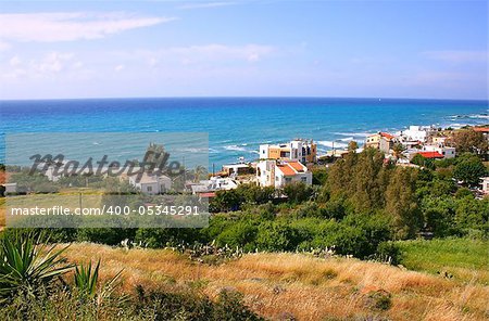 Cyprus landscape with mountain village and Mediterranean sea.