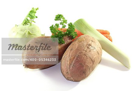 Sweet potatoes, leeks, kohlrabi, carrots and parsley on a white background