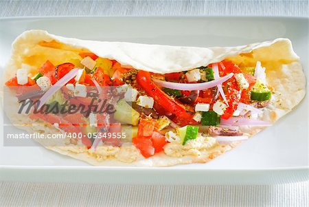 fresh homemade salad wrap on pita bread,very healthy food