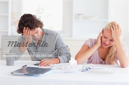 Couple in great despair in their living room