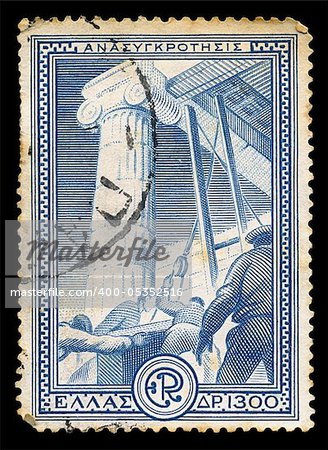 GREECE - CIRCA 1951. Vintage postage stamp printed for the financial aid program Marshall Plan under the U.S. assistance for the reconstruction of Europe, with workers restoring ancient monument illustration, circa 1951.