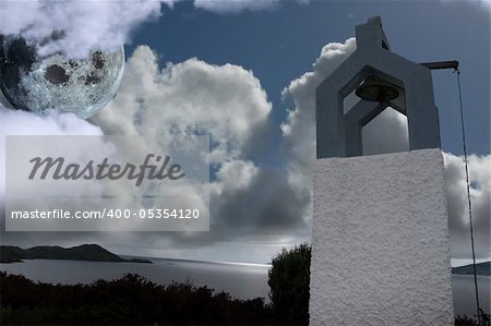 bell tower under a full moon with scenic view in kerry ireland of coastline
