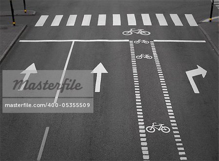 street with lanes, arrows and a cycling path