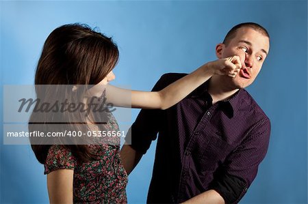 Young woman punching men in a face