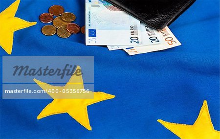Wallet and Euro banknotes on an EU flag background