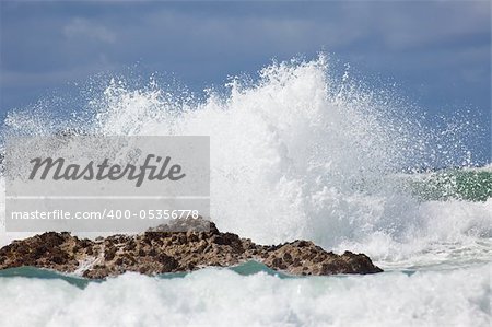 Wave crashing against rocks