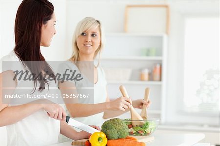 Young Women preparing dinner in a kitchen