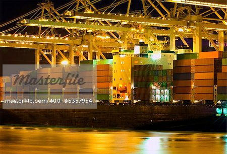 Close up of a container ship being unloaded