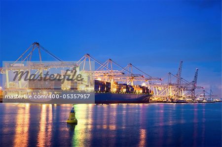 The activity of loading and unloading of huge container ships at the world's biggest and busiest container harbor in Rotterdam