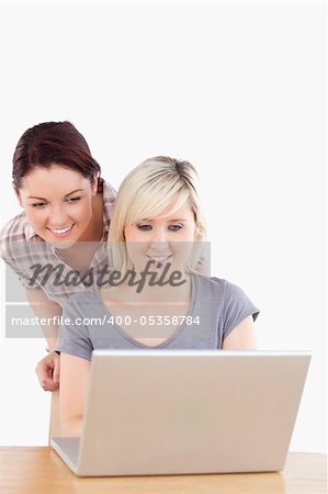 Beautiful women with a laptop in a studio