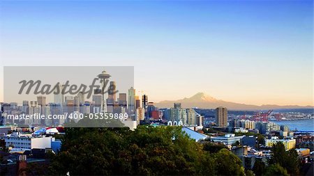 Panoramic view of Seattle with Mt. Rainier visible in the background. Horizontally framed shot.
